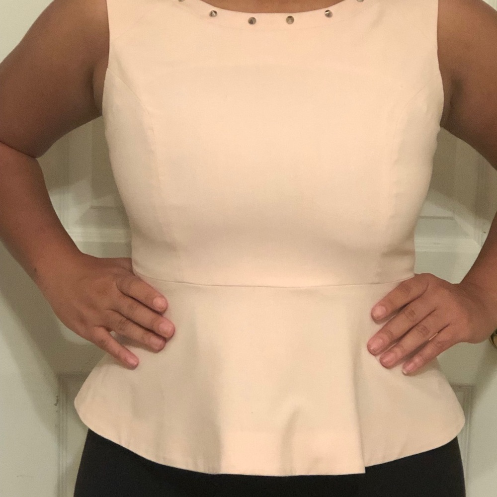 Blush Peplum with a spiked collar